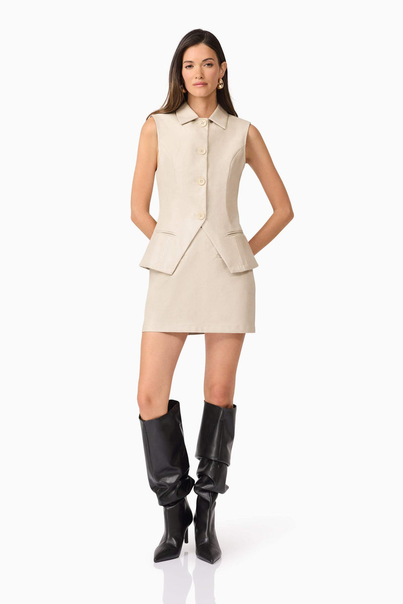 Brunette model wearing  Malia Leather Vest In Beige posed shot