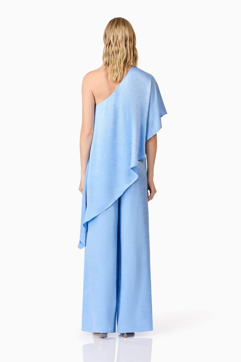 Blonde model wearing Fleur Satin Trousers in Blue back shot