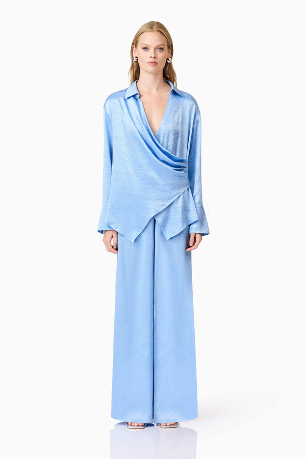 Blonde model wearing Fluer Satin Shirt In Blue front shot