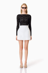 Blonde model wearing Kira Stretch Lace Top In Black front shot