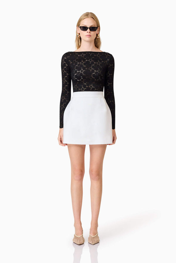 Blonde model wearing Kira Stretch Lace Top In Black front shot