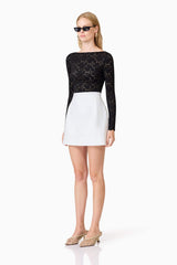 Blonde model wearing Kira Stretch Lace Top In Black side shot