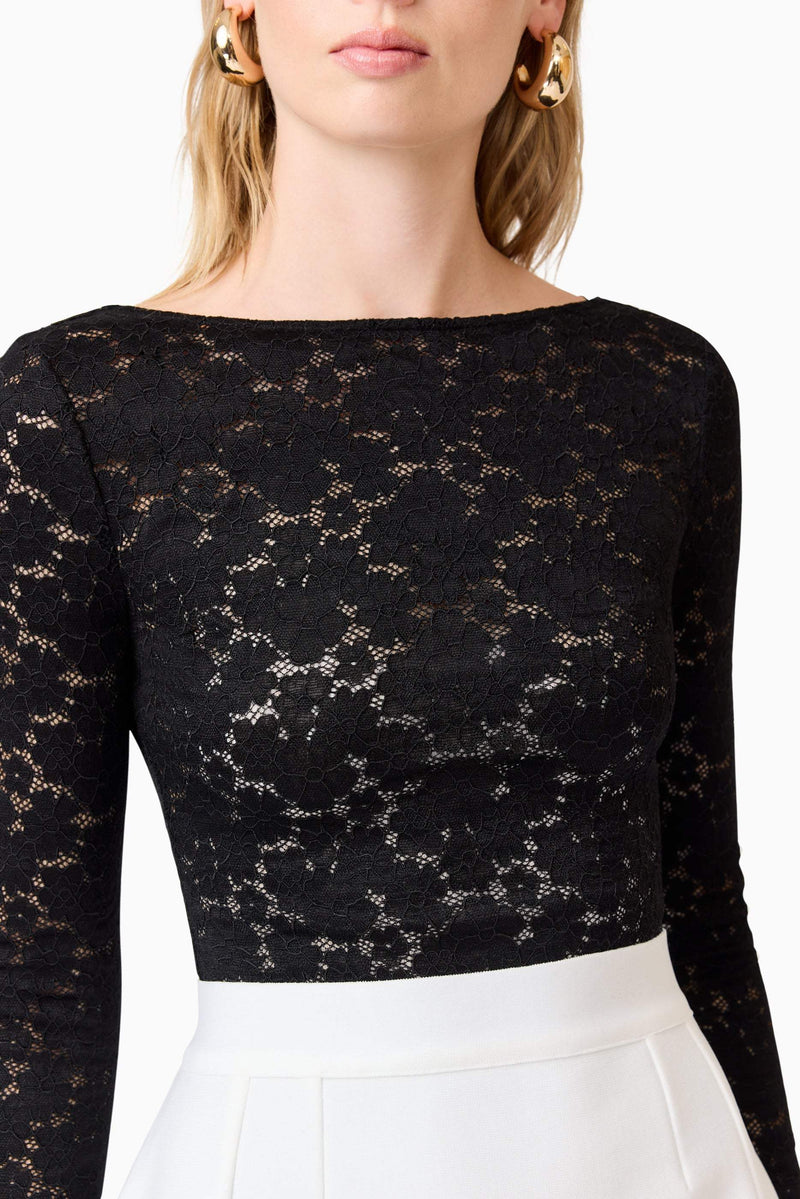 Blonde model wearing Kira Stretch Lace Top In Black detail shot