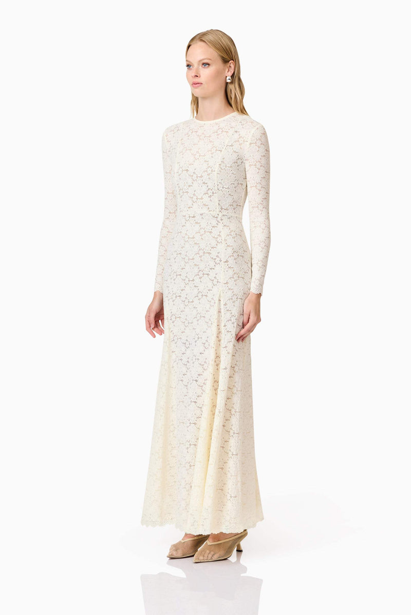 Blonde model wearing Kira Stretch Lace Maxi Dress In White side shot