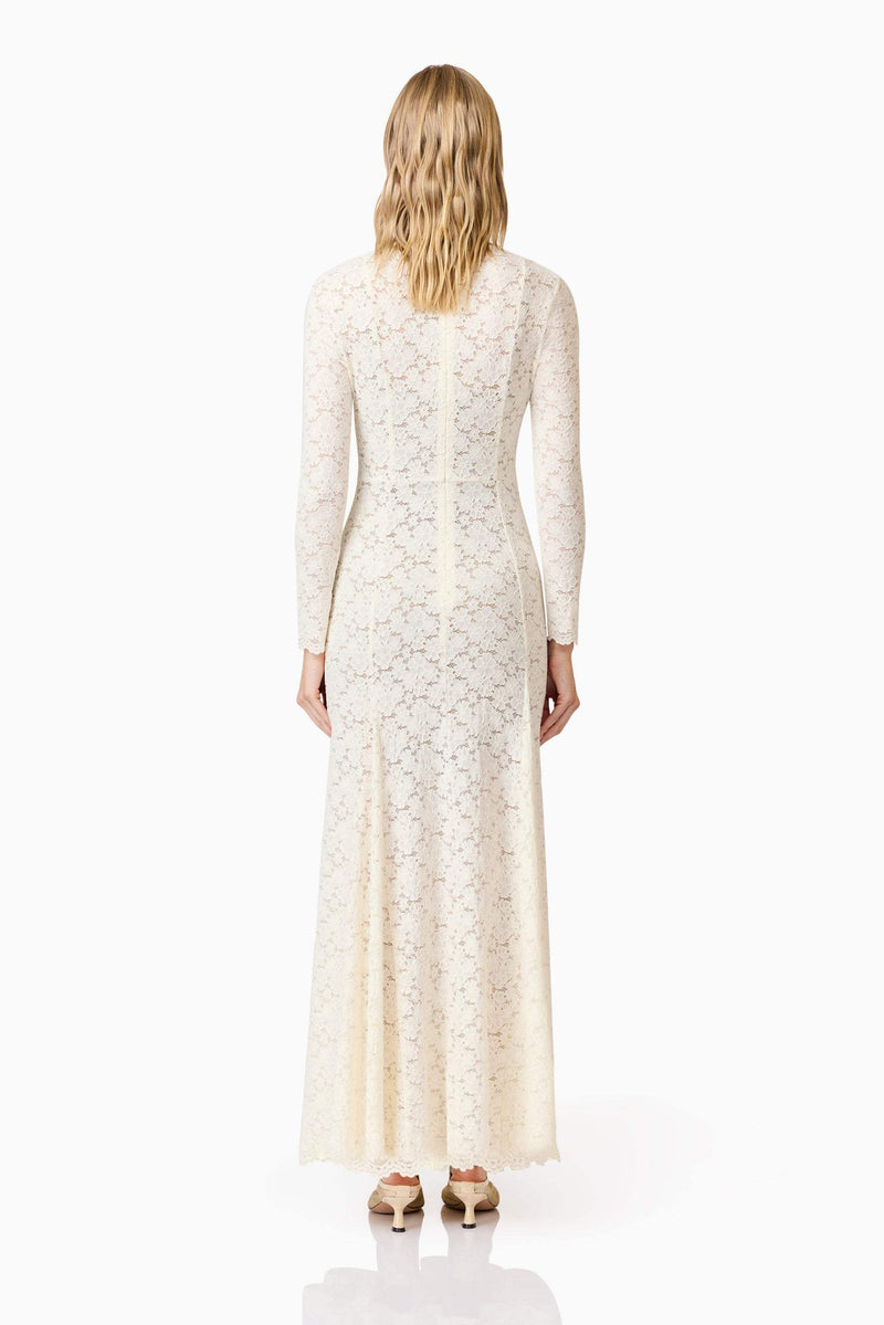Blonde model wearing Kira Stretch Lace Maxi Dress In White back shot