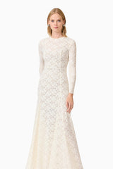 Blonde model wearing Kira Stretch Lace Maxi Dress In White posed shot