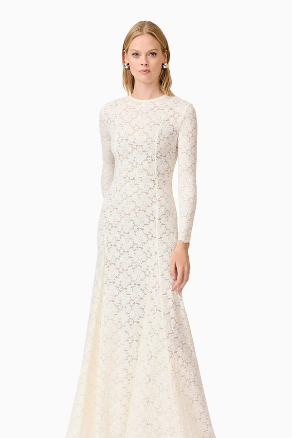 Blonde model wearing Kira Stretch Lace Maxi Dress In White posed shot