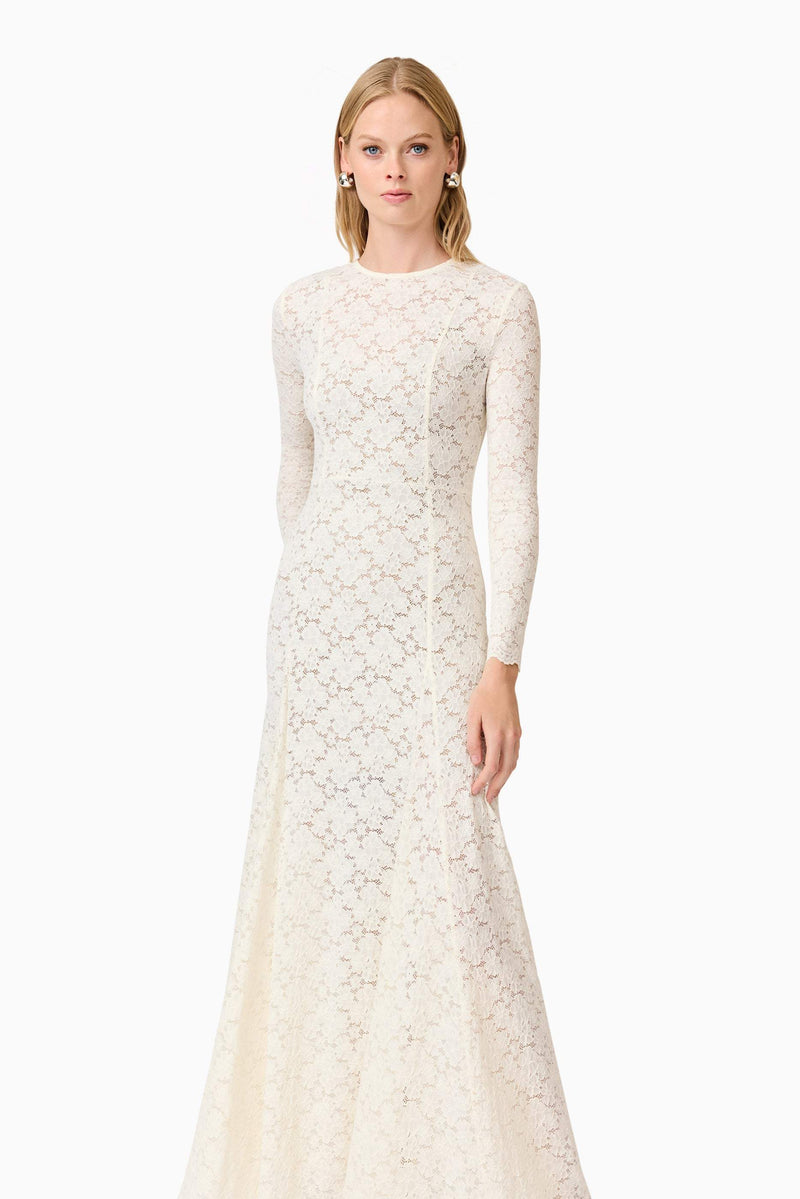 Blonde model wearing Kira Stretch Lace Maxi Dress In White posed shot