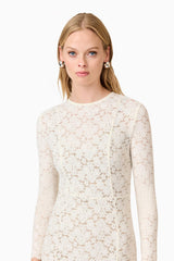 Blonde model wearing Kira Stretch Lace Maxi Dress In White close up shot