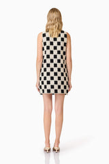 Blonde model wearing  Soho Crochet Mini Dress in Black & White back shot