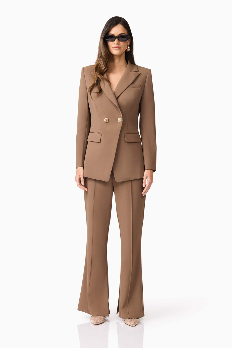 Brunette model wearing Sandy Suit Trouser In Brown front shot