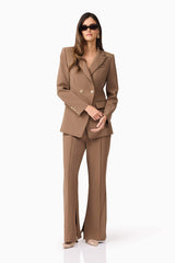 Brunette model wearing Sandy Suit Trouser In Brown posed shot