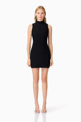 Blonde model wearing Amyra Textured Stretch Mini Dress In Black front shot