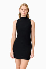 Blonde model wearing Amyra Textured Stretch Mini Dress In Black close up shot