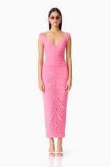 Brunette woman in CURAAE Ordelia Maxi Dress in Pink front shot