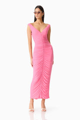 Brunette woman in CURAAE Ordelia Maxi Dress in Pink posed shot