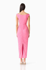 Brunette woman in CURAAE Ordelia Maxi Dress in Pink back shot