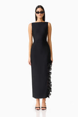 Brunette woman in the CURAAE Catiana Maxi Dress in Black front shot