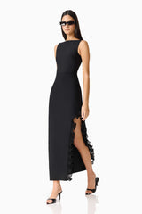 Brunette woman in the CURAAE Catiana Maxi Dress in Black posed shot