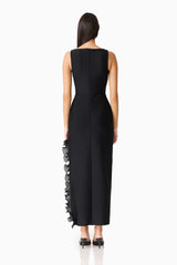 Brunette woman in the CURAAE Catiana Maxi Dress in Black back shot
