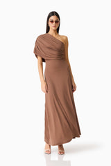 Brunette model wearing the CURAAE Gizelle Maxi Dress in Brown posed shot