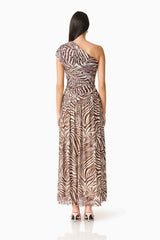 Brunette woman in CURAAE Arabelle Maxi Dress in Chocolate Zebra Print back shot
