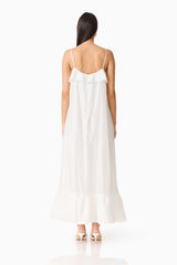 Brunette model wearing the CURAAE Estrella Maxi Dress in White back shot