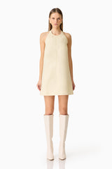 Brunette model wearing the Lavelle Halter Mini Dress in Lemon Yellow front shot