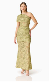 Brunette model wearing the Fiorella Skirt in Pistachio Green posed shot 
