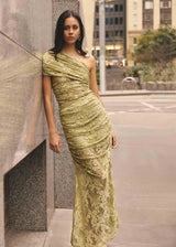 Brunette model wearing the Fiorella Skirt in Pistachio Green campaign shot 
