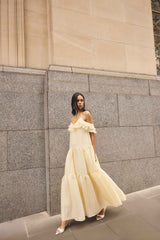 Brunette model wearing the Maribelle Maxi Dress in Lemon Yellow Campaign  shot 
