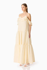 Brunette model wearing the Maribelle Maxi Dress in Lemon Yellow side  shot 