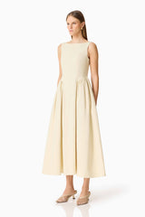 Brunette model wearing the Lavelle Maxi Dress in Lemon Yellow side shot