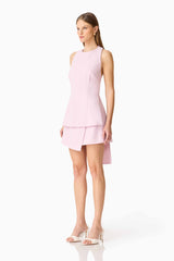 Brunette model wearing the Celie Top & Skirt Set in Blush Pink side shot