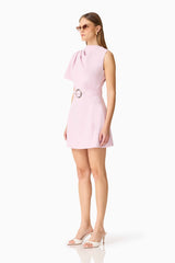 Brunette model wearing the Celie Mini Dress in Blush Pink side shot