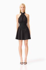 Blonde model wearing the Amaris Halter Mini Dress in Black front shot 