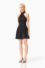 Blonde model wearing the Amaris Halter Mini Dress in Black side shot 