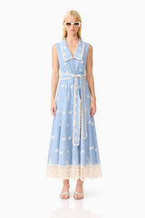 Blonde model wearing the CURAAE Estella Midi Dress in Blue & Cream front shot