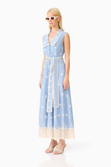 Blonde model wearing the CURAAE Estella Midi Dress in Blue & Cream side shot