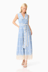 Blonde model wearing the CURAAE Estella Midi Dress in Blue & Cream posed shot