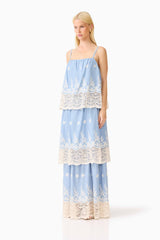 Blonde model wearing the CURAAE Estella Maxi Dress in Blue & Cream side shot 