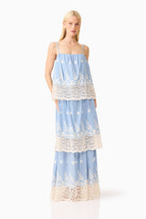 Blonde model wearing the CURAAE Estella Maxi Dress in Blue & Cream posed shot 