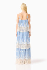 Blonde model wearing the CURAAE Estella Maxi Dress in Blue & Cream back shot 