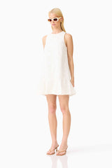 Blonde model wearing the Sierra Mini Shift Dress in White side shot