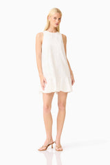 Blonde model wearing the Sierra Mini Shift Dress in White posed shot