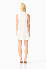 Blonde model wearing the Sierra Mini Shift Dress in White back shot