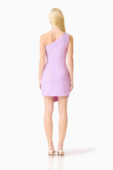 Blonde model wearing the Rafaella One Shoulder Mini Dress in Purple back shot