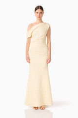 Brunette model wearing the CURAAE Faye One Shoulder Maxi Dress in Cream front shot 