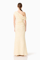 Brunette model wearing the CURAAE Faye One Shoulder Maxi Dress in Cream back shot 