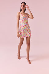 Brunette model wearing the CURAAE Bijou Mini Dress in Multi Campaign shot